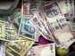 Rupee gains 12 paise against U.S. Dollar in early trade